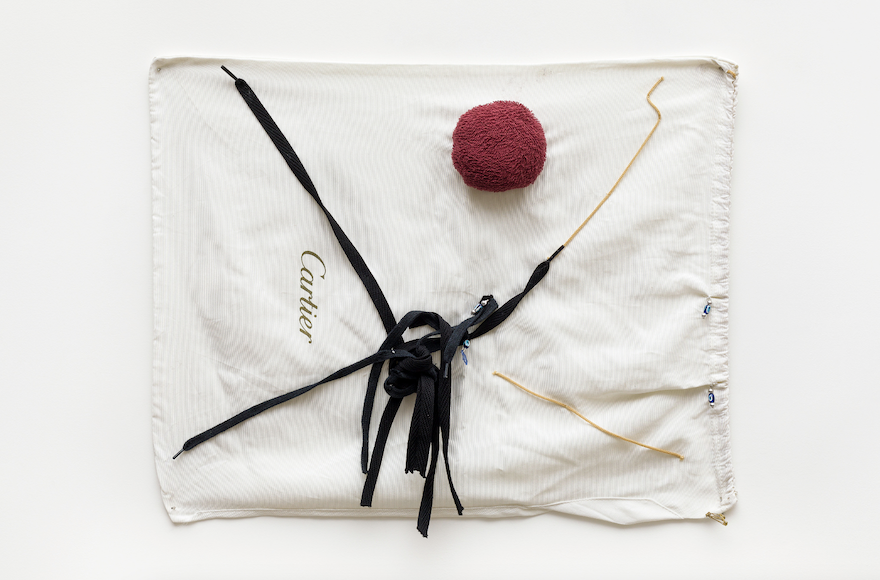 Cartier bag with sewing and pompom decoration