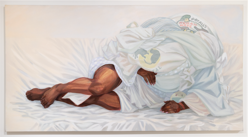 A couple consumed by drapery (white sheets)